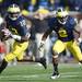 Michigan quarterback Devin Gardner looks to pass as running back Vincent Smith runs beside him in the second quarter at Michigan Stadium. Melanie Maxwell I AnnArbor.com